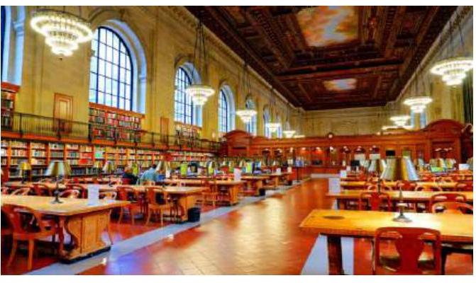 Rose Main Reading Room with wooden benches and golden lamps